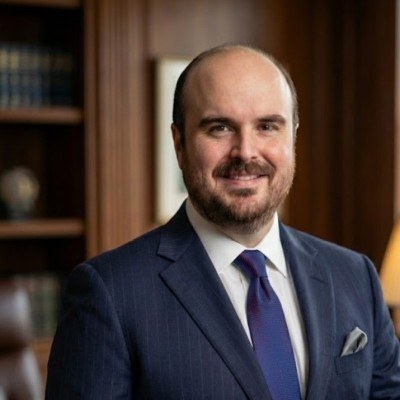 Victor Williams, product management leader, in a navy suit